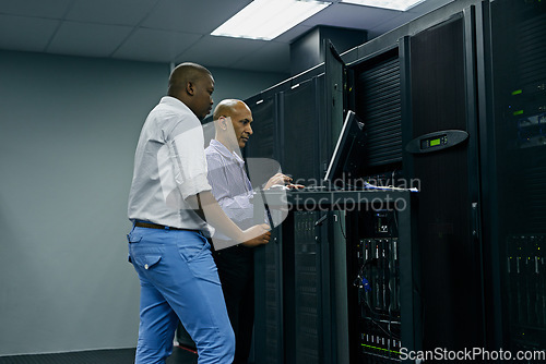 Image of Server room, people or technicians coding on computer together for a cybersecurity glitch with teamwork. IT support code, collaboration or engineers fixing pc network for information technology