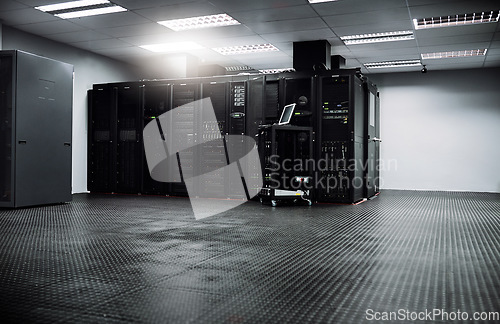 Image of Control room, empty or hardware for internet connection, computing network or cyber security system. IT support background, information technology electronics or machine equipment in data center