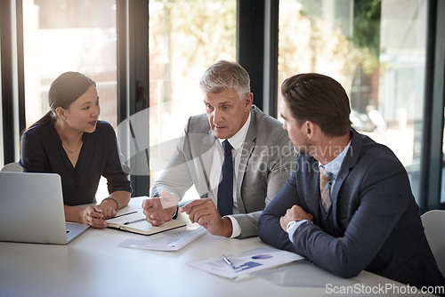 Image of Meeting, collaboration and workshop with a manager and team in the boardroom for a coaching seminar. Teamwork, strategy and planning with a mature CEO business man talking to his staff in the office