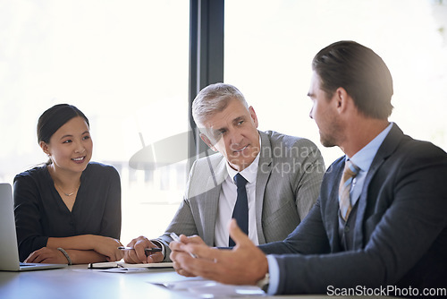 Image of Meeting, collaboration and strategy with a manager and team in the boardroom for a coaching seminar. Teamwork, planning and workshop with a mature CEO business man talking to his staff in the office