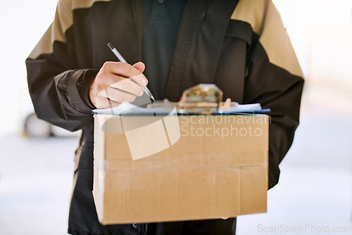 Image of Delivery man, box and hands with a package and pen for signature on paper at front door. Logistics worker with a courier company parcel in cardboard for e commerce shipping or mail distribution