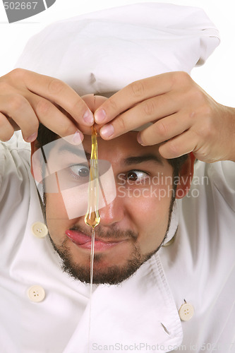 Image of funny chef cracking an egg