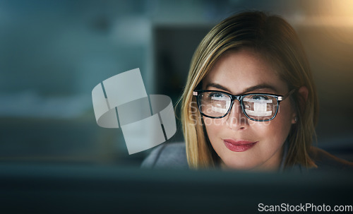 Image of Glasses, serious and business woman at night on a computer or working late or editor for a project deadline and in an office. Research, email and overtime or corporate worker or analysis and on pc