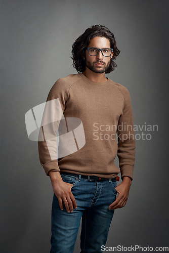 Image of Glasses, portrait and serious man in studio isolated on a gray background. Face, spectacles and handsome male person from Brazil with eyewear or frames for fashion, stylish and aesthetic mockup.