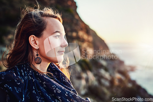 Image of Beach, woman and enjoying sunset outdoors or relaxed for vacation in summer or thinking in nature and on bokeh. Face, view and female person on break or mindfulness for scenic travel on holiday