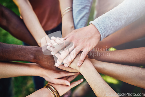 Image of Teamwork, hands and above friends outdoor for partnership, collaboration and goal motivation. Team building, top view and person with fingers in support of mission, strategy and community with trust