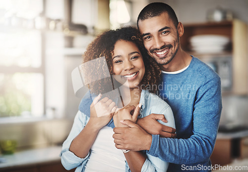 Image of Love, portrait and happy couple hug in kitchen of home with smile, embrace and healthy relationship. Happiness, man and woman hugging in affection, romance and care in marriage, young people in house