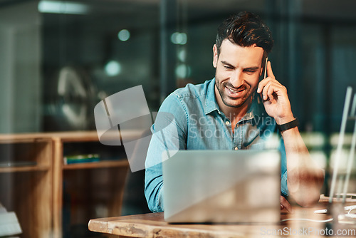 Image of Happy man talking with phone at laptop in office, conversation and communication for online planning. Male worker, cellphone contact and call at computer for mobile networking in startup business