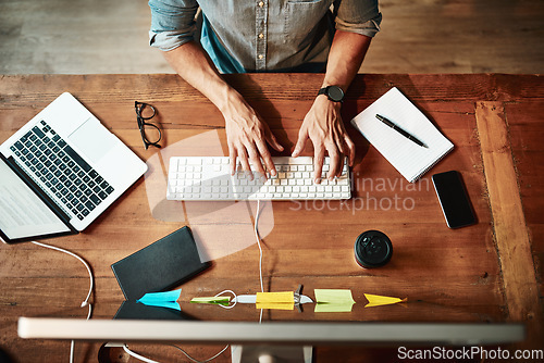 Image of Top view, computer and business man typing for planning, strategy and online data analysis at office desk. Hands of worker, desktop and keyboard for tech, research and productivity in startup agency