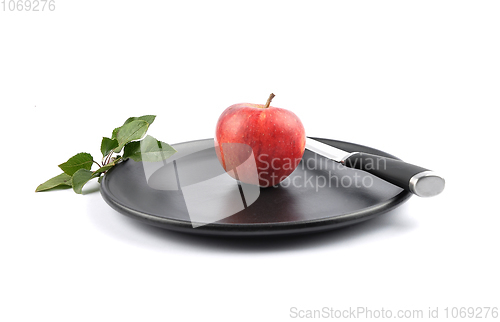 Image of Apple on plate and white