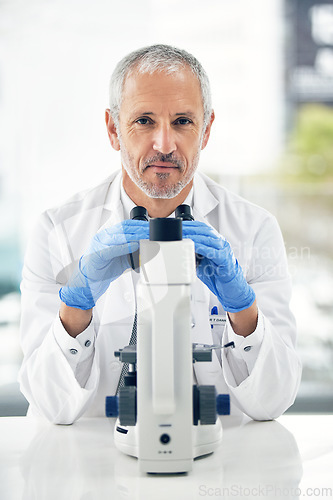 Image of Senior man, microscope and portrait of scientist in forensic science, breakthrough or discovery at laboratory. Serious male person, medical or healthcare professional in scientific research at a lab