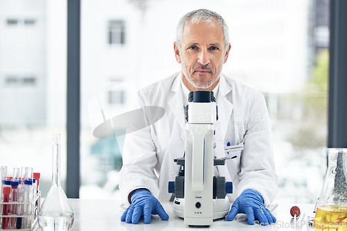 Image of Man, microscope and portrait of scientist in science research, breakthrough or discovery at the laboratory. Senior male doctor, medical or healthcare professional in scientific chemistry at the lab