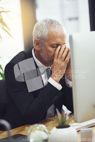 Image of Business, fail and senior man with headache while working on computer in office, annoyed and anxiety. Burnout, migraine and elderly male manager frustrated with online glitch, 404 or bad review