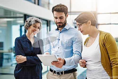 Image of Business people, tablet and meeting in team collaboration for planning, idea or strategy at office. Group of employee workers on technology in teamwork for research, project plan or networking