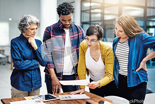 Image of Data, diversity and design team working on startup company strategy in collaboration or brainstorming together. Office, growth and small business group of employees in a meeting planning