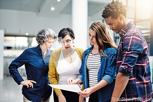 Image of Document, diversity and designer team planning or brainstorming strategy in collaboration together at a startup. Company, growth and business analyst meeting of group of employees working in teamwork