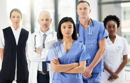 Image of Healthcare, team and portrait of doctors with nurses in hospital with arms crossed for leadership or support. Diversity, mindset and proud face of medical group in solidarity or service collaboration