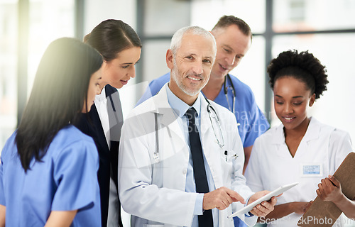 Image of Senior doctor, team or group with tablet, smile and portrait for leadership, discussion or planning together in hospital. Medic man, mentor and medical student with teamwork, women and healthcare job