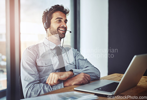 Image of Man, call center and laptop for listening in office, help desk or talking for telemarketing job. Consultant, agent and crm with customer service, tech support or telecom with headphones, mic and job