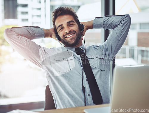 Image of Happy businessman, relax and portrait in call center for customer service, support or telemarketing break at office. Friendly man person, consultant or agent smiling and relaxing with hands on head