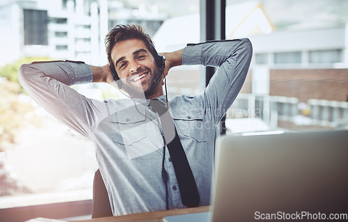 Image of Businessman, relax and portrait smile in call center for customer service, support or telemarketing break at office. Happy man person, consultant or agent smiling and relaxing with hands on head