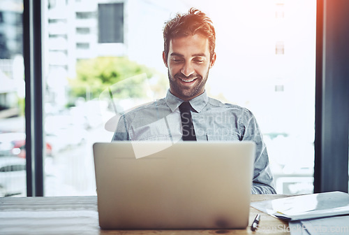 Image of Business man, smile and laptop work of an auditor in a office with happiness. Company, male employee online and worker working and planning on a computer with internet and finance email at desk