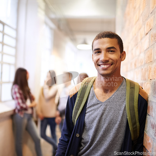 Image of University, education and portrait of man at college ready for studying, class and learning. Scholarship, knowledge and face of male student in hallway with friends for school, academy and campus