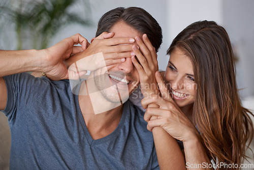 Image of Covering eyes, couple and happy surprise in living room or woman with partner, hands cover face and hide reveal. Girlfriend, man and love or playing together, guess who or excited announcement