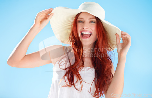 Image of Happy woman, excited portrait and straw hat outdoor on blue sky, fun style and freedom to relax. Female person, red hair and smile in sunshine with fashion accessory, happiness and summer holiday