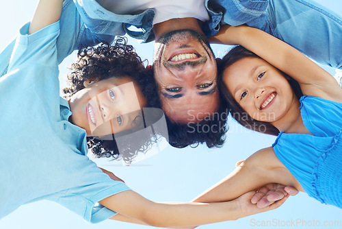 Image of Portrait, blue sky and happy family hug, father and children bonding, support and solidarity circle for care, unity or love. Group face, freedom and below view of kids, parent or people together