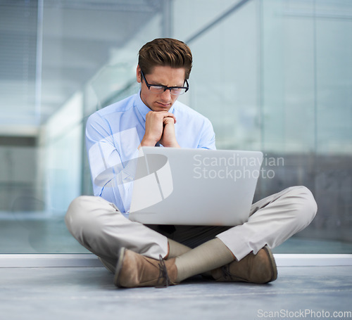 Image of Laptop, office and man focus, thinking and stress over business finance report, feedback analytics or financial loss. Reading, statistics analysis and person problem solving mistake error on floor