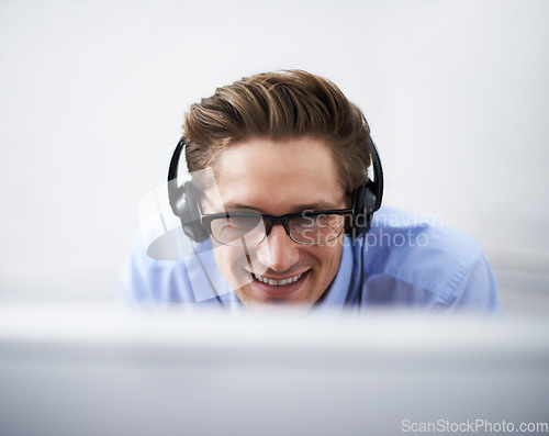 Image of Office computer, face and happy man reading, smile and happiness for script success, software code or IT work. Information technology, cybersecurity developer or closeup person listening to music