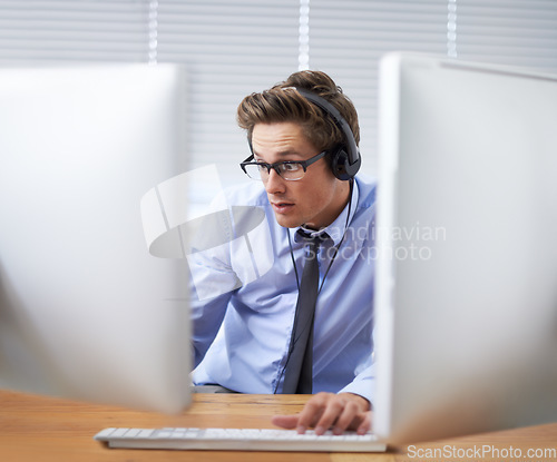 Image of Computer, office surprise and business man shocked over information technology news, system notification or report. Listening to music, cybersecurity developer and person reading script, code or data