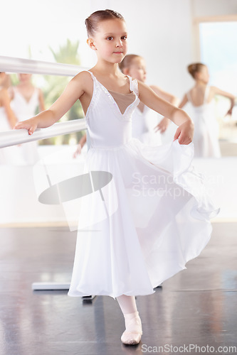 Image of Young girl, ballerina and ballet training with dancer at academy, practice dancing at studio. Female child learning to dance in lesson, creativity with fitness and balance, focus and concentration