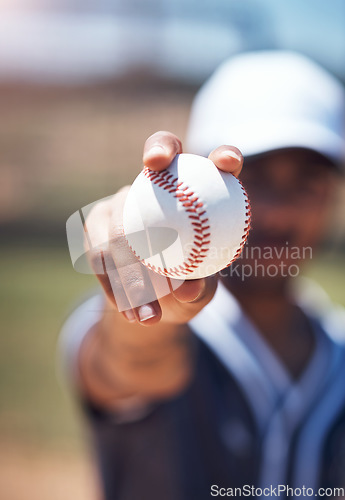 Image of Hand holding baseball, closeup and man for sport, field and training with blurred background in sunshine. Softball player, sports and zoom of ball for training, fitness and workout for competition