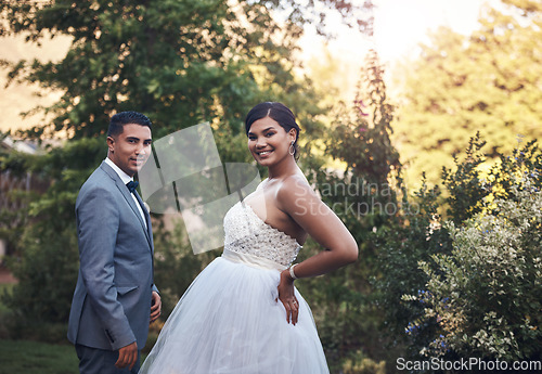 Image of Portrait, man and woman on wedding in the garden with happiness and love to celebrate the ceremony. Couple, marriage and celebration in the outdoor for commitment with greenery and smile together.