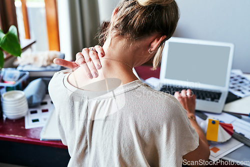 Image of Neck pain, mockup and laptop screen with back of woman in fashion design studio for website, tired and frustrated. Stress, burnout and mental health with designer for planning, anxiety and tension