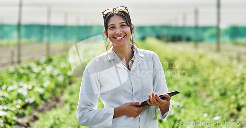 Image of Portrait, tablet and agriculture with a woman in a greenhouse on a farm for organic sustainability. Food, spring and a female farmer outdoor to manage fresh vegetables or produce crops for harvest