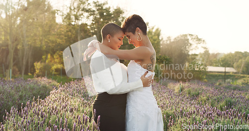 Image of Love, wedding and lgbtq with lesbian couple in nature for celebration, hugging and pride. Gay, spring and marriage ceremony with women in field for commitment, queer sexuality and freedom