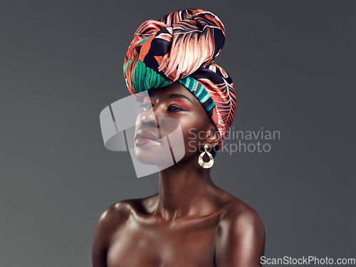 Image of Beauty, African fashion and face of black woman in studio with glamour, cosmetics and makeup. Thinking, luxury and female person in exotic jewellery, African style and head scarf on gray background