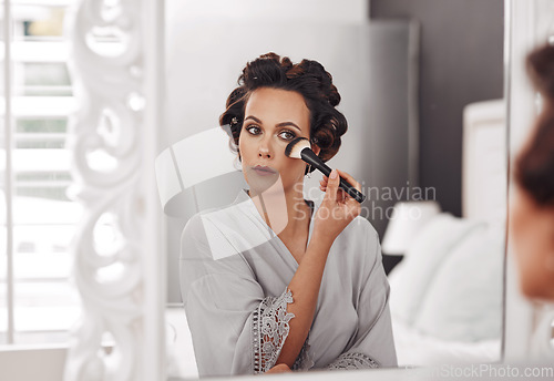 Image of Beauty brush, mirror reflection and woman with cosmetics application, natural skincare glow or luxury facial makeup. Wellness, skin foundation treatment and person prepare for wedding in home bedroom