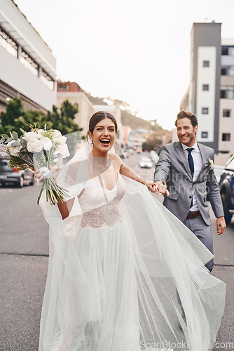 Image of Wedding, run and a happy couple in a city outdoor together after a ceremony of tradition or love. Flowers, marriage or smile with a man and woman holding hands while running as husband and wife