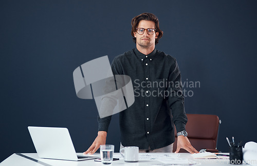 Image of Portrait, serious and business man, architect or professional in office by wall mockup space. Glasses, designer and confident face of male person from Australia with success mindset and pride for job