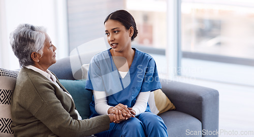 Image of Old woman, holding hands or consulting a nurse for support or empathy for healthcare help for cancer therapy. Talking, psychology or elderly sick patient in counseling with caregiver in consultation