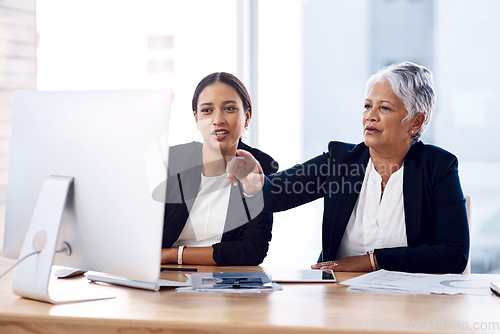 Image of Mentor, training or business women with computer talking, speaking or planning a project in office. Technology, teamwork collaboration or senior manager explaining to an intern for digital coaching