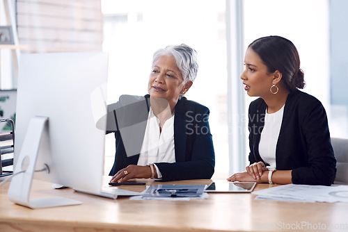 Image of Mentor, coaching or business women with computer talking, speaking or planning a project in office. Technology, teamwork collaboration or senior manager explaining to an intern for digital training