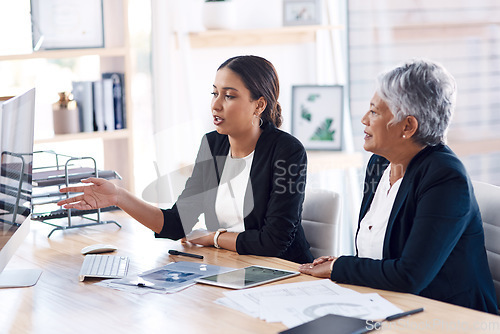 Image of Mentor, teamwork or business women with computer talking, speaking or planning a project in office. Technology, collaboration or senior manager with female intern for strategy training or coaching