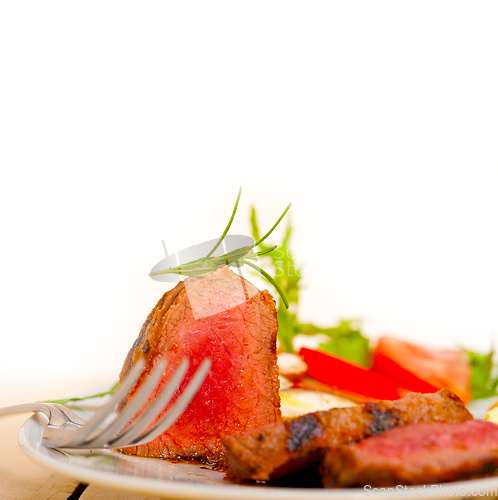 Image of beef filet mignon grilled with vegetables