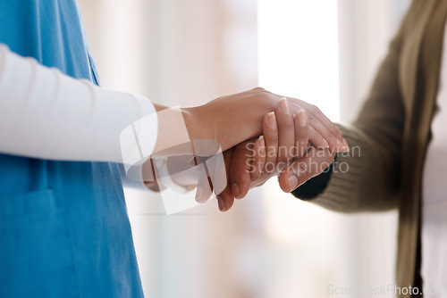 Image of Woman, holding hands or consulting a caregiver for support or empathy for healthcare service of cancer therapy. Closeup, psychology clinic or sick patient in counseling with a nurse in consultation
