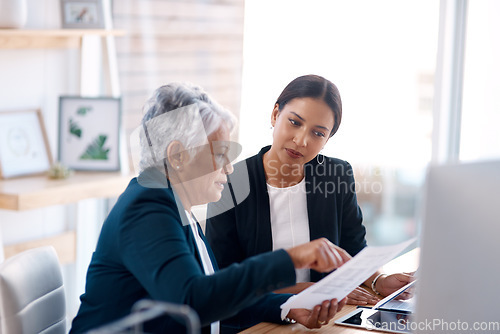 Image of Mentor, training or business women with documents talking, speaking or planning project in office. Paperwork, teamwork collaboration or senior manager reading with intern for administration coaching